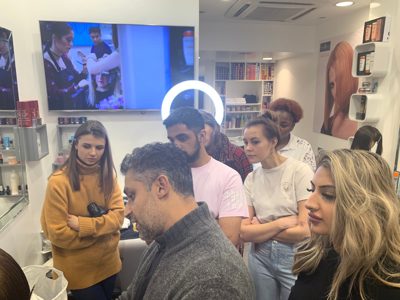 Director teaching all employees during a cutting session